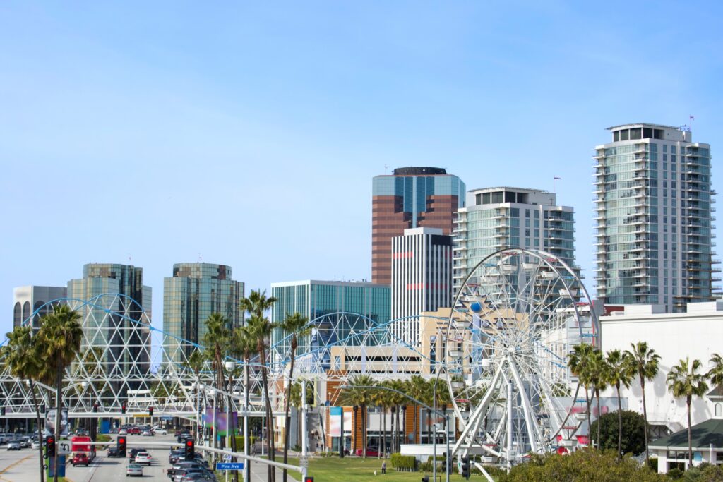 Skyline of Long Beach featuring tall buildings, a ferris wheel, and a clear sky. This image is used for a Long Beach Public Relations case study.